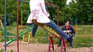 stock-footage-couple-on-seesaw